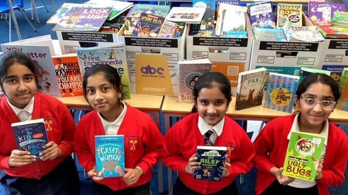 School Pupils Excited Amids Book Donation from Charity.