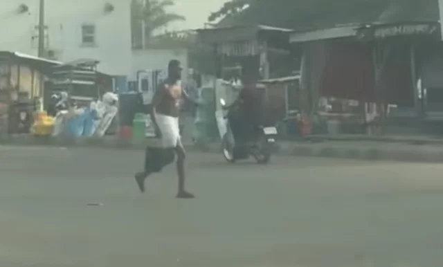 VIDEO: Outrage as man bathes in the middle of a busy road