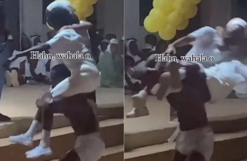 VIDEO: “He don break their spinal cords” – Reactions as hefty corper attempts to lift two ladies at a time during ‘Mr Macho’ competition in NYSC camp