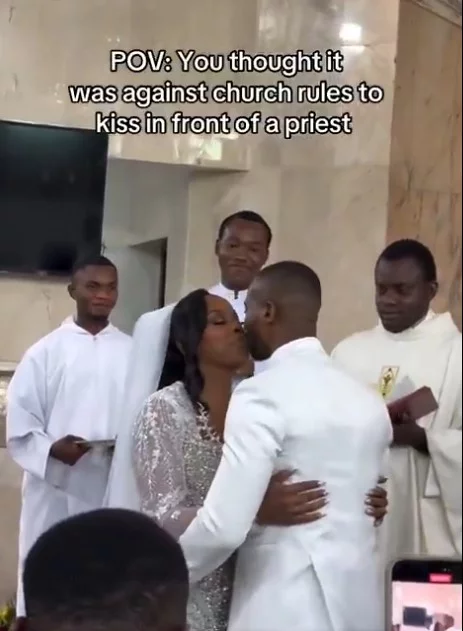 VIDEO: What newly wedded couple did while kissing in front of the priest